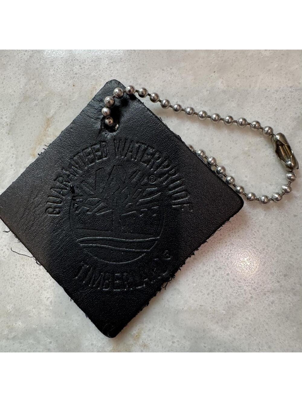 Timberland Guaranteed Waterproof Black Leather Hang Tag Keychain Advertising